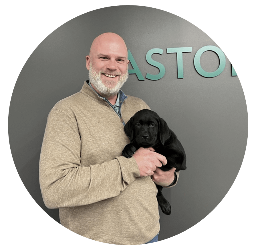 CEO Holds Puppy Dog